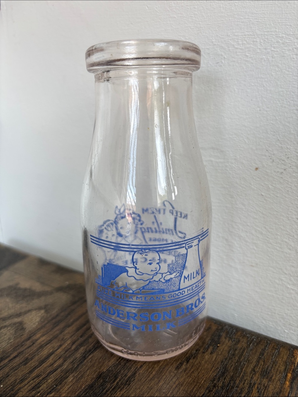 Vintage Anderson Bros milk/cream bottle, 5.25” tall, blue graphics
